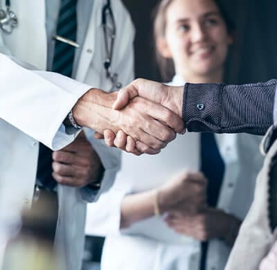 Doctor and patient shaking hands