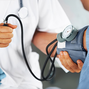 A doctor checking blood pressure of patient