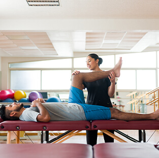 A man getting physical therapy treatment