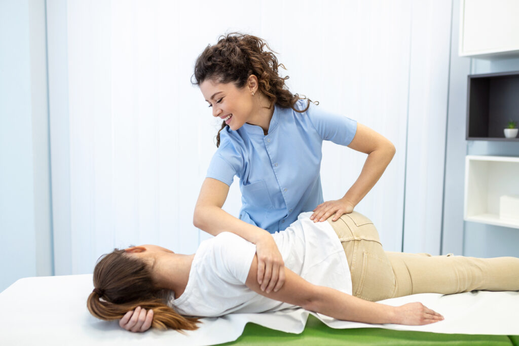 Professional chiropractor during work