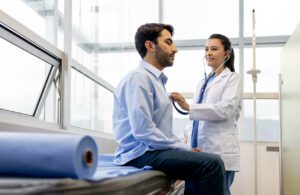 Female doctor examining a patient at her office